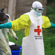 A health worker is sprayed with disinfectant after working in an Ebola treatment center in Beni, Eastern Congo.